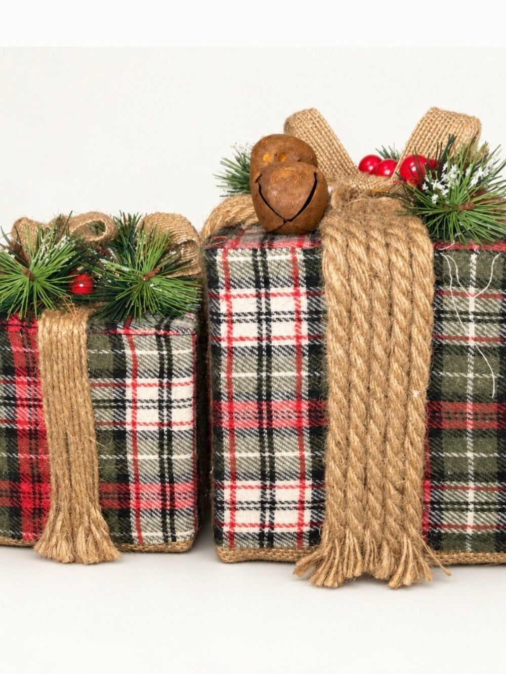 Christmas primitive plaid gifts adorned with burlap ribbon, faux pine sprigs,